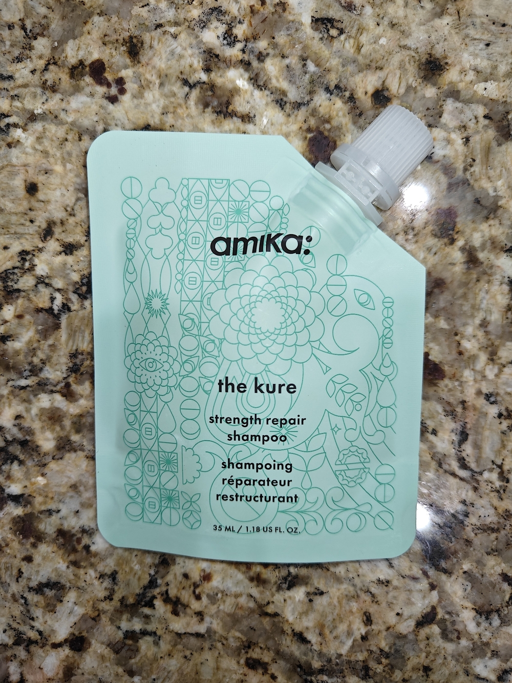 amika The Kure Strength Repair Shampoo - mint green pouch
